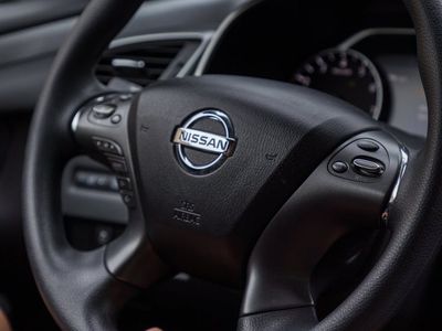 Close-up of a person's hands in a precise, controlled gesture.